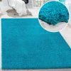 Paco Home Tapis Shaggy Longues Mèches En Différentes Tailles Et Coloris -Magasin Joss & Main shaggy teppich hochflor uni einfarbig kuschelig wohnzimmer teppich flauschig weich oekotex geprueft neu tuerkis turqouise 2